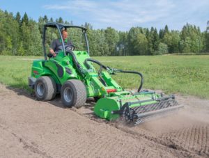 Avant compact loader with rotary hoe or rotavator